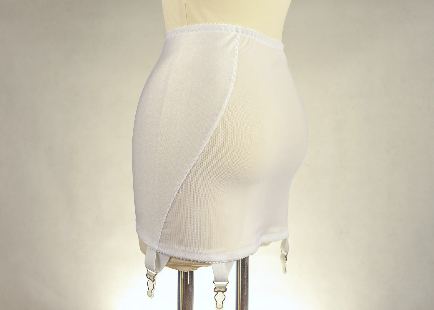 beige 6 strap Rhonda open bottom girdle, with sheer back and lace trim on the front, side view