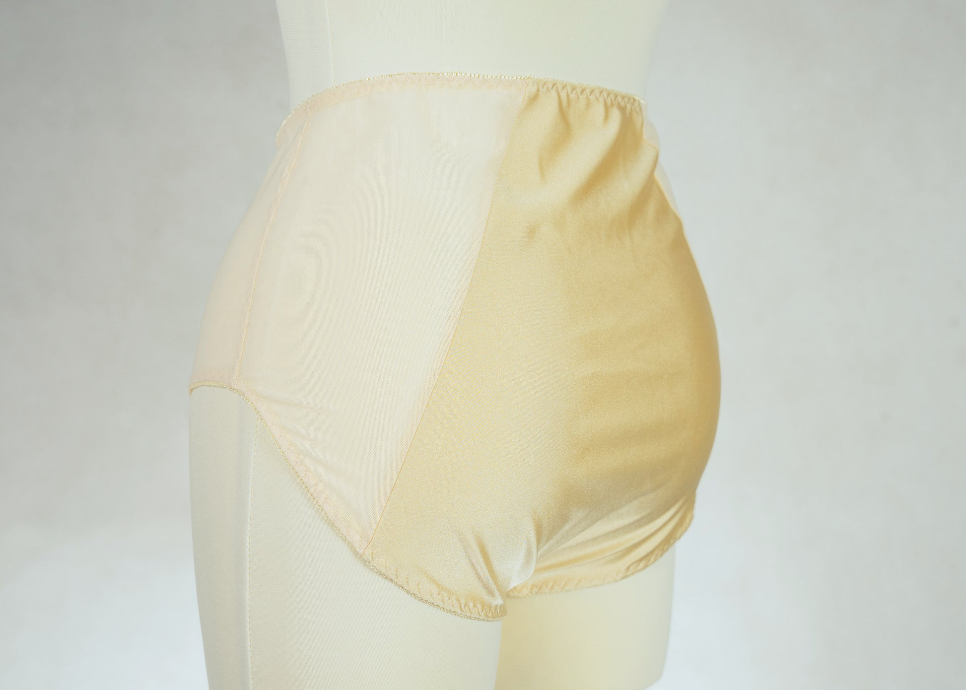 beige high waist Mia panties with sheer side panels, back view