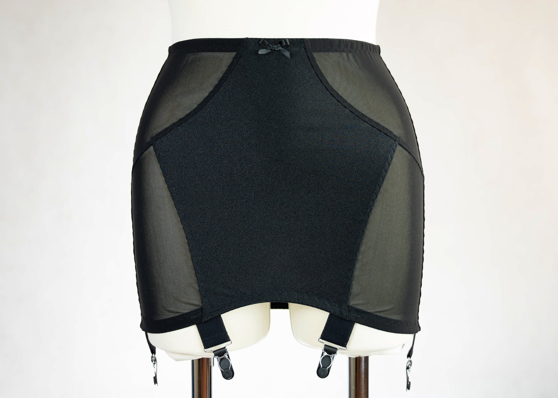 black Open bottom Glenda girdle made with opaque front and back panels with sheer power mesh side panels.
