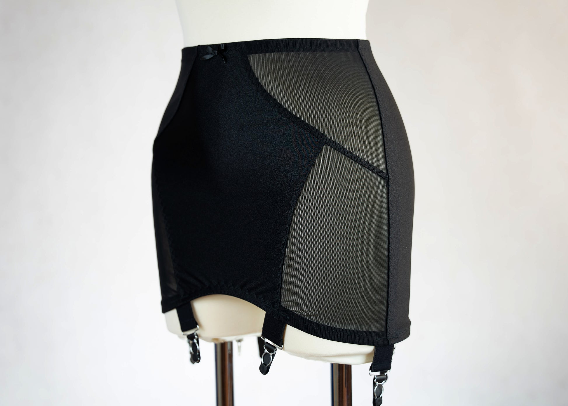 black Open bottom Glenda girdle made with opaque front and back panels with sheer power mesh side panels. Can be made with 4 or 6 extra wide straps.