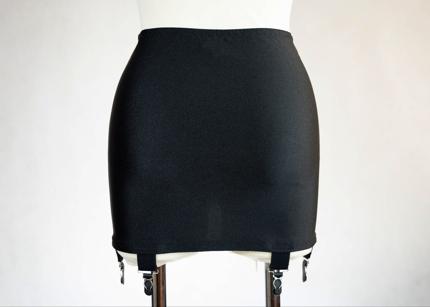 black Open bottom Glenda girdle made with opaque front and back panels with sheer power mesh side panels. back view