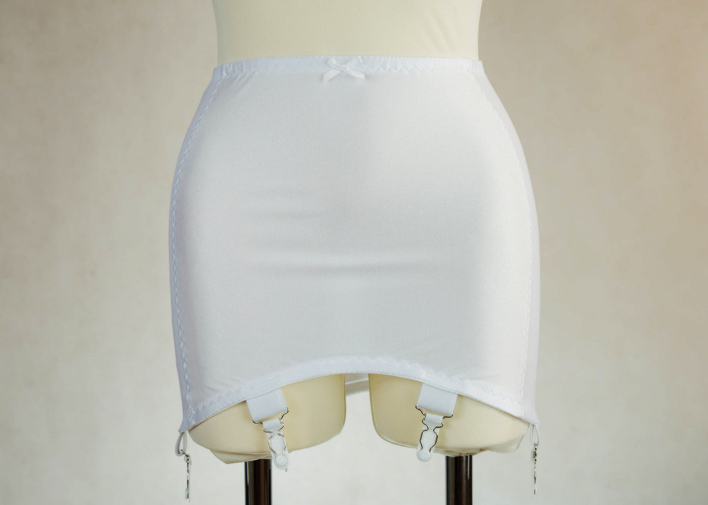 White smooth, light control, pull on girdle made with spandex and power mesh side panels. With 6 v style non-adjustable straps. You can have solid color girdle or mix of colors for just your own different girdle