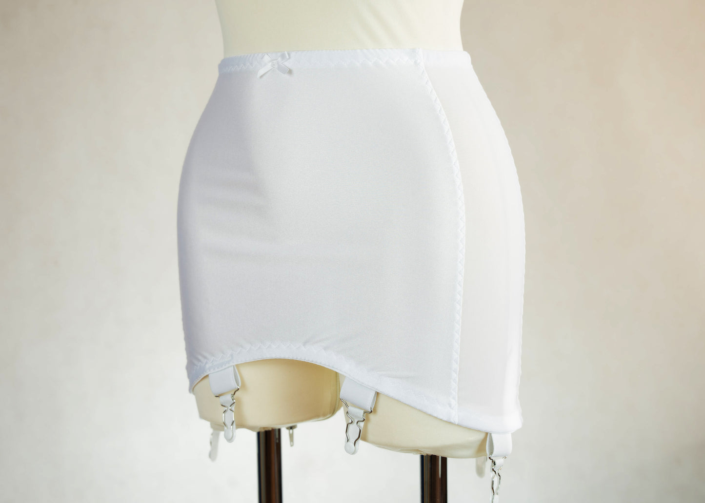White smooth, light control, pull on girdle made with spandex and power mesh side panels. With 6 v style non-adjustable straps. You can have solid color girdle or mix of colors for just your own different girdle