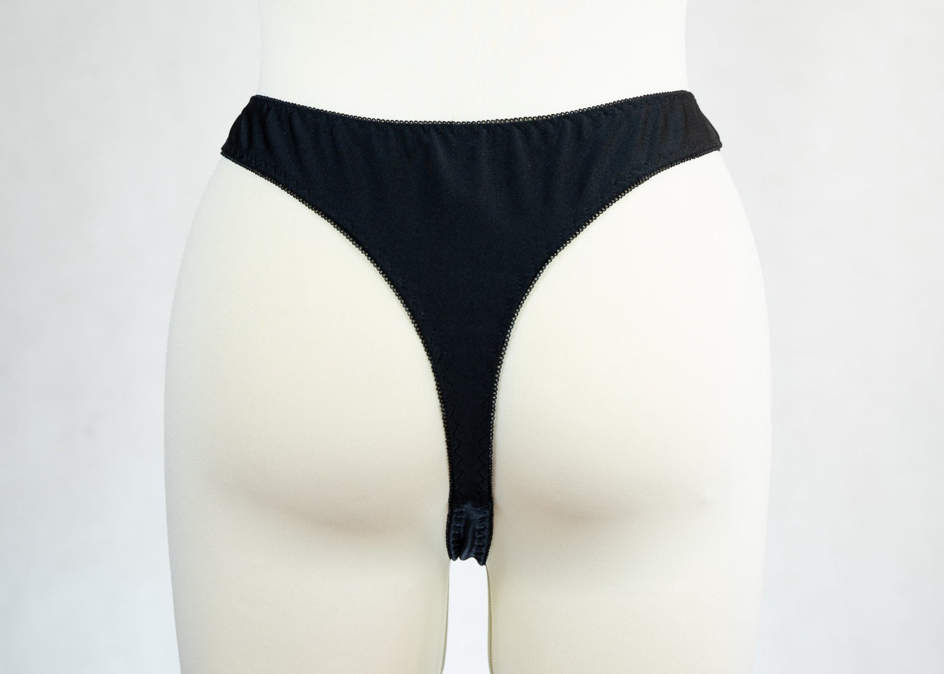 black high waist Ivy thong panties with lace side panels, back view