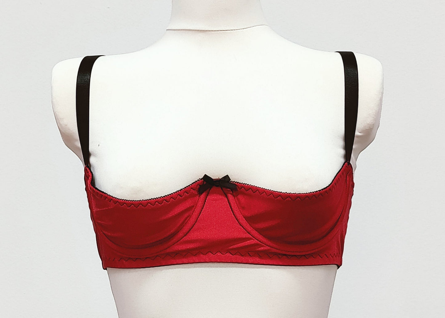 red open quarter cup Gina bra with black straps and trim