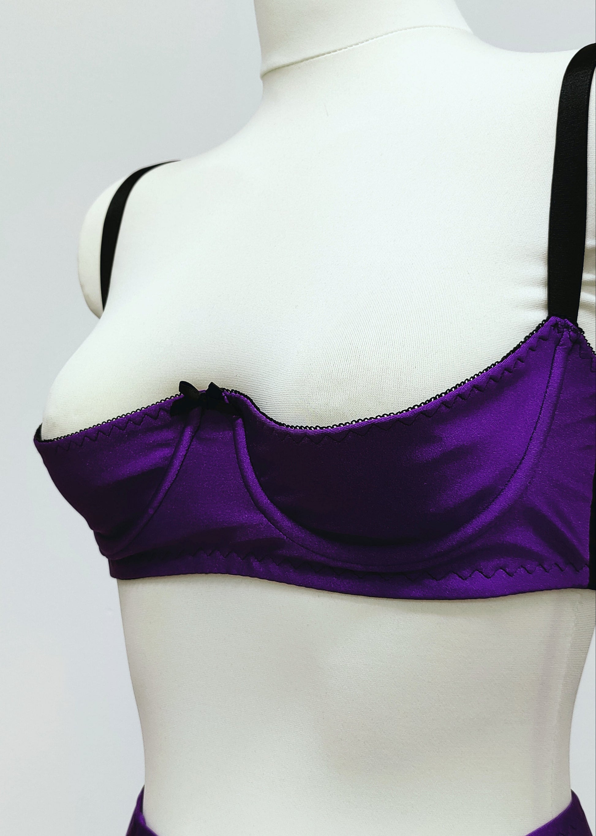 purple open quarter cup Gina bra with black straps and trim