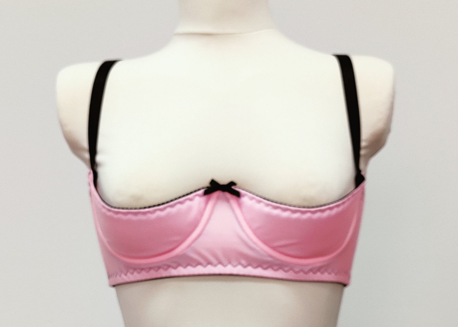 pink open cup bra with black straps and trim