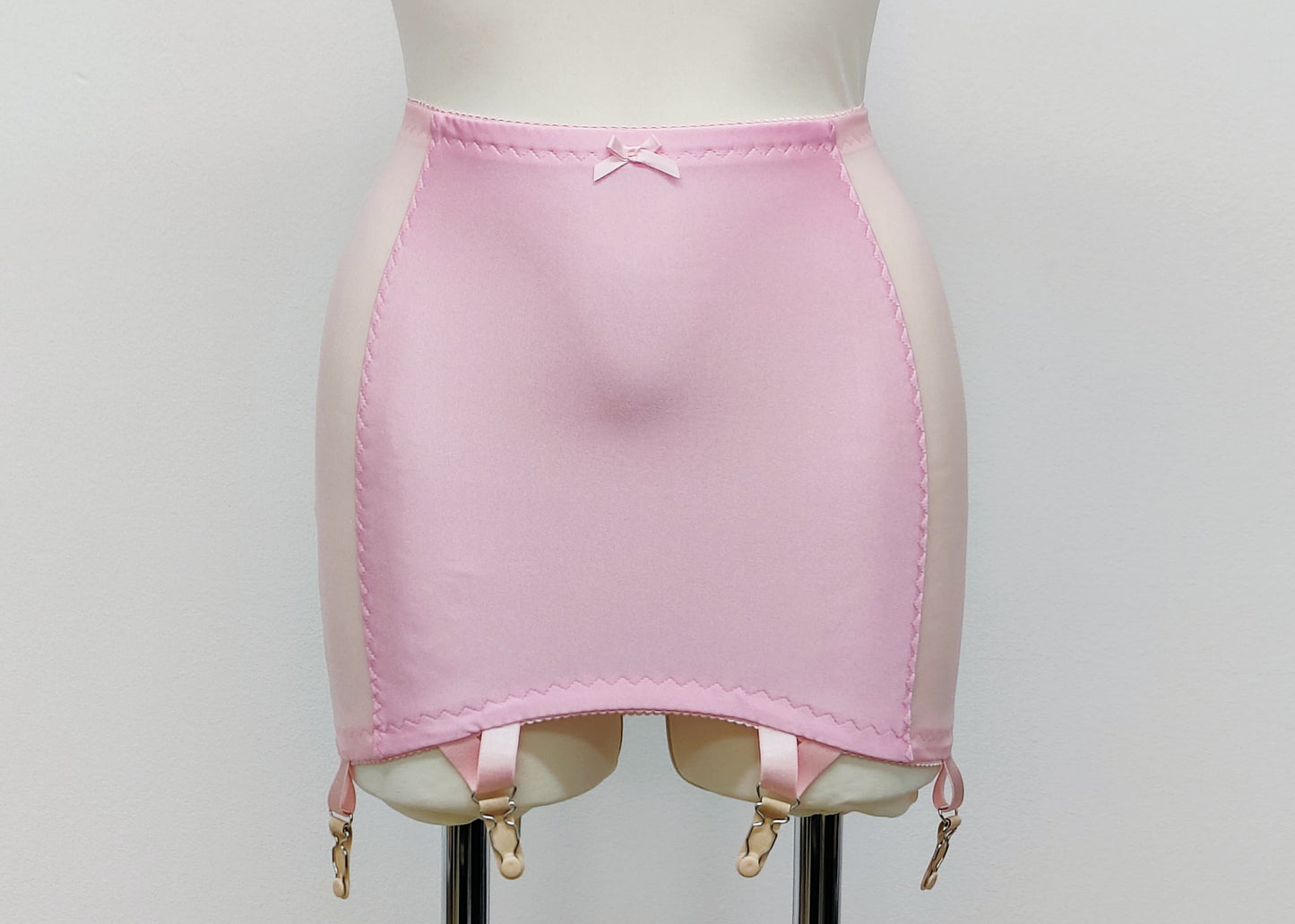 Pink smooth, light control, pull on girdle made with spandex and power mesh side panels. With 6 v style non-adjustable straps. You can have solid color girdle or mix of colors for just your own different girdle