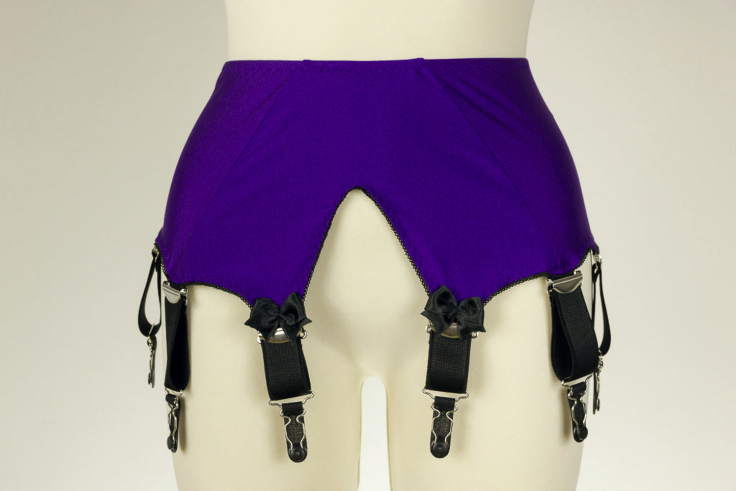 wide vintage style Iris garter belt, purple with extra wide black straps, with larger bows on the front straps
