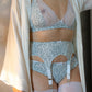 white cotton with tiny green leaves Etta garter belt, with matching Mila bralette and Ida panties, on model