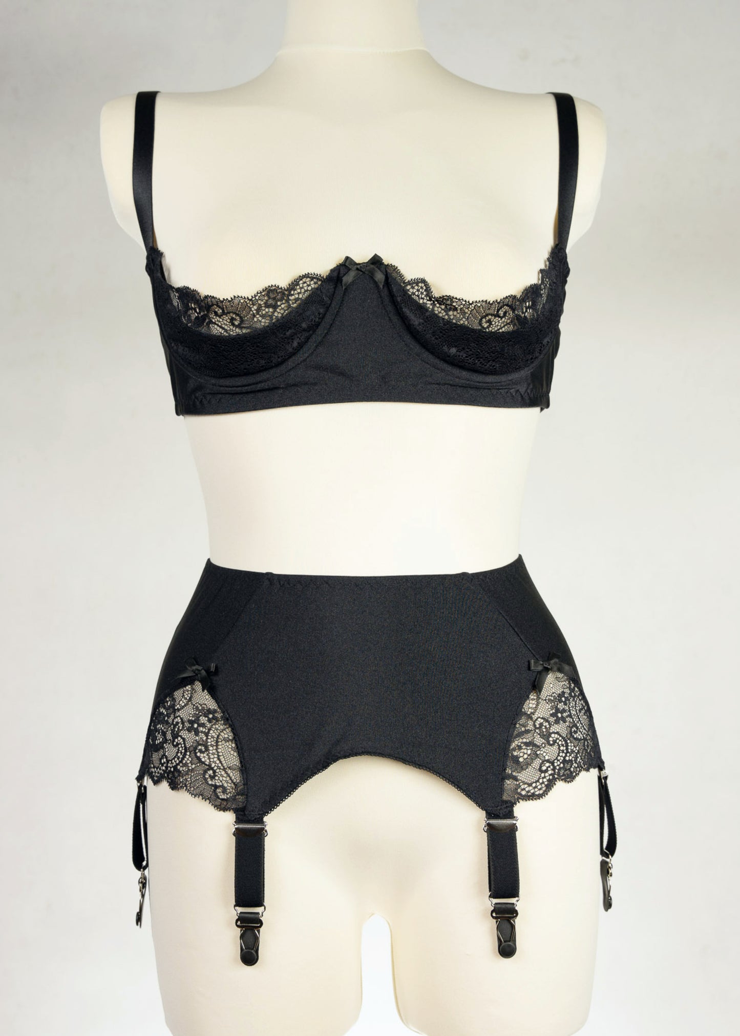 black, retro style, 6 strap Scarlett garter belt with black straps and lace side inserts, shown with matching Lucy quarter cup bra