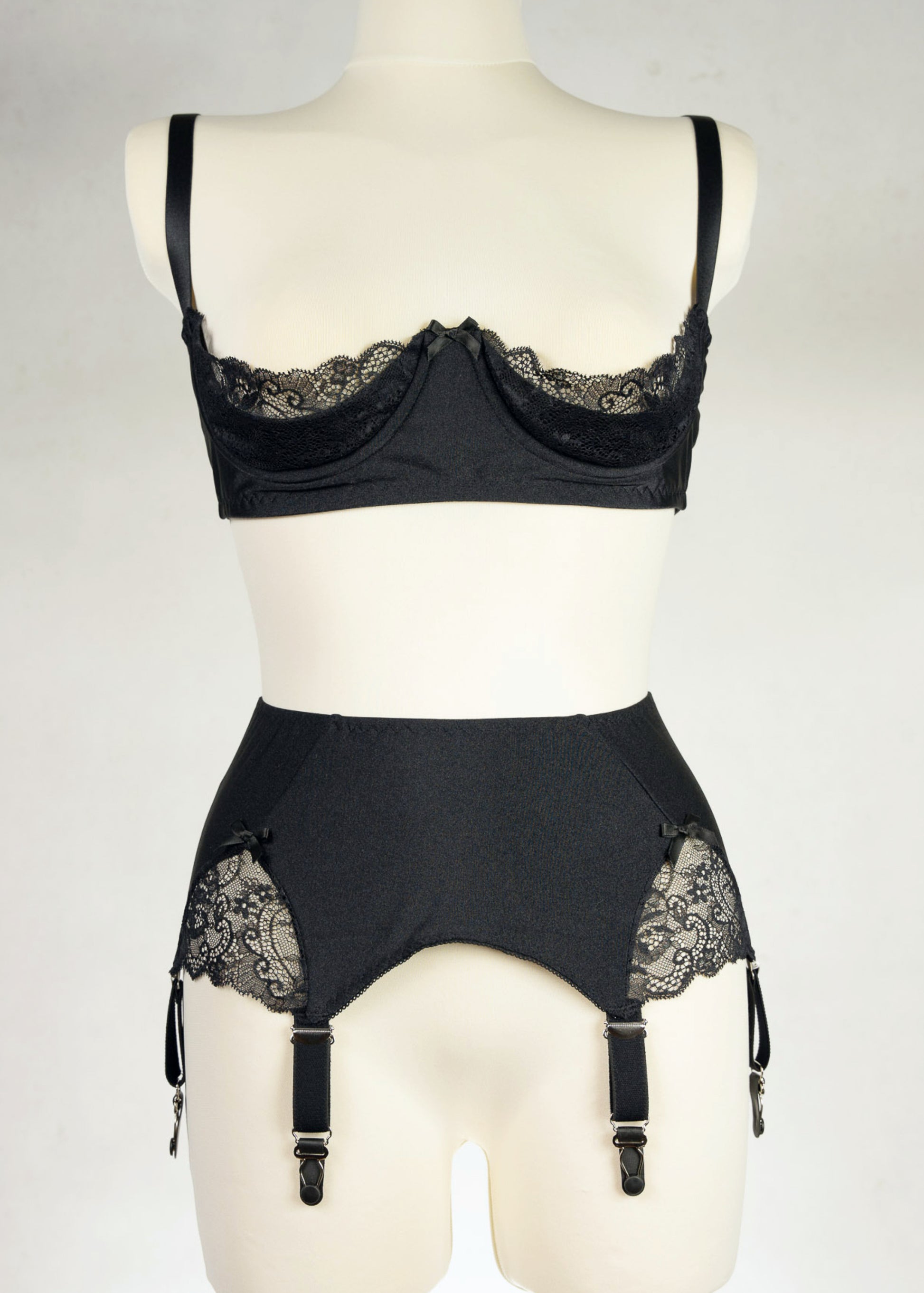 black, retro style, 6 strap Scarlett garter belt with black straps and lace side inserts, shown with matching Lucy quarter cup bra