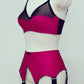 magenta pink wide vintage style Iris garter belt, with black trim and 6 extra wide black straps, here shown with matching Audrey full cup bra, side view