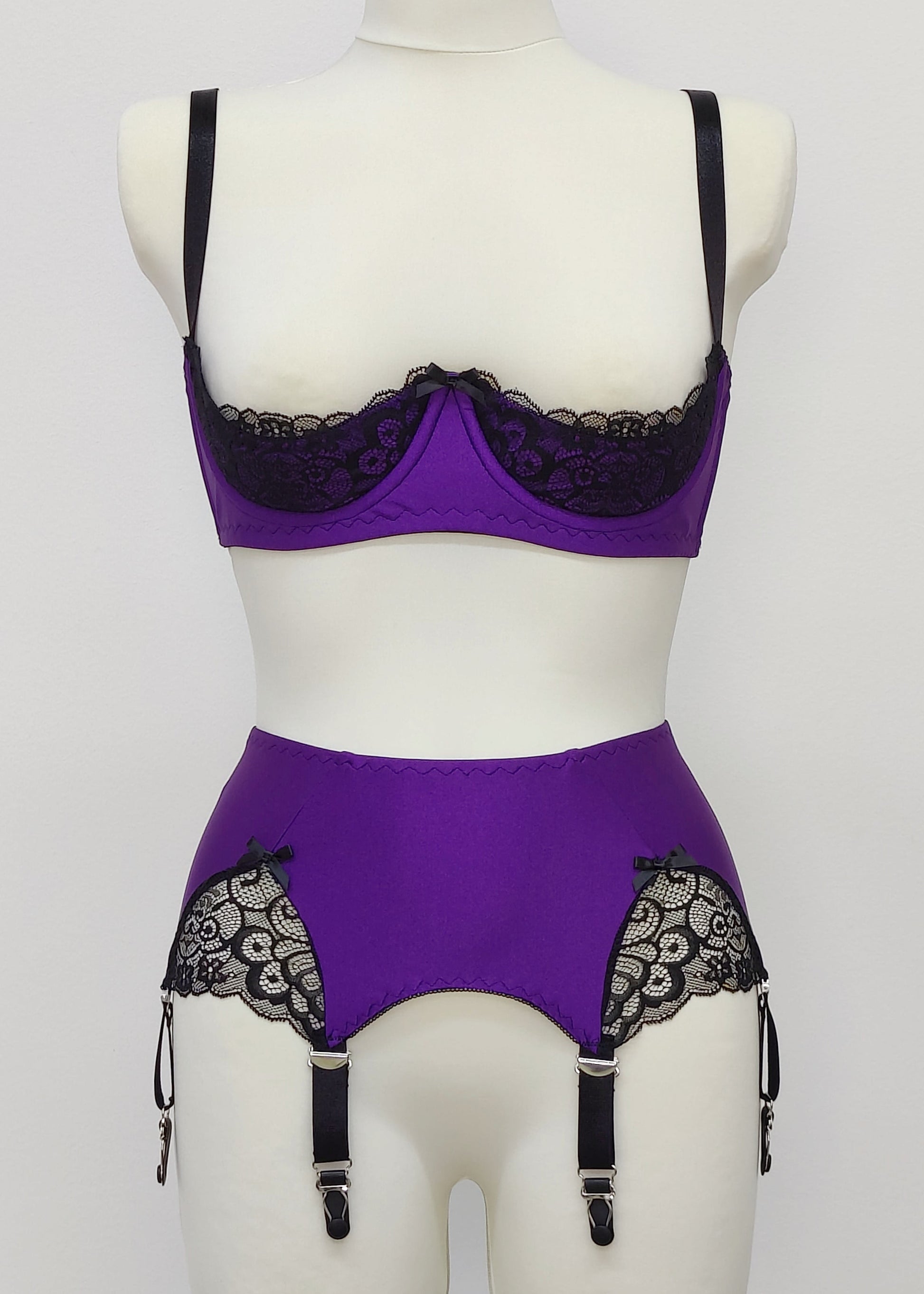 Purple LUCY Quarter cup bra with black lace and straps, size US 34C or EU 70C, in combination with matching garter belt