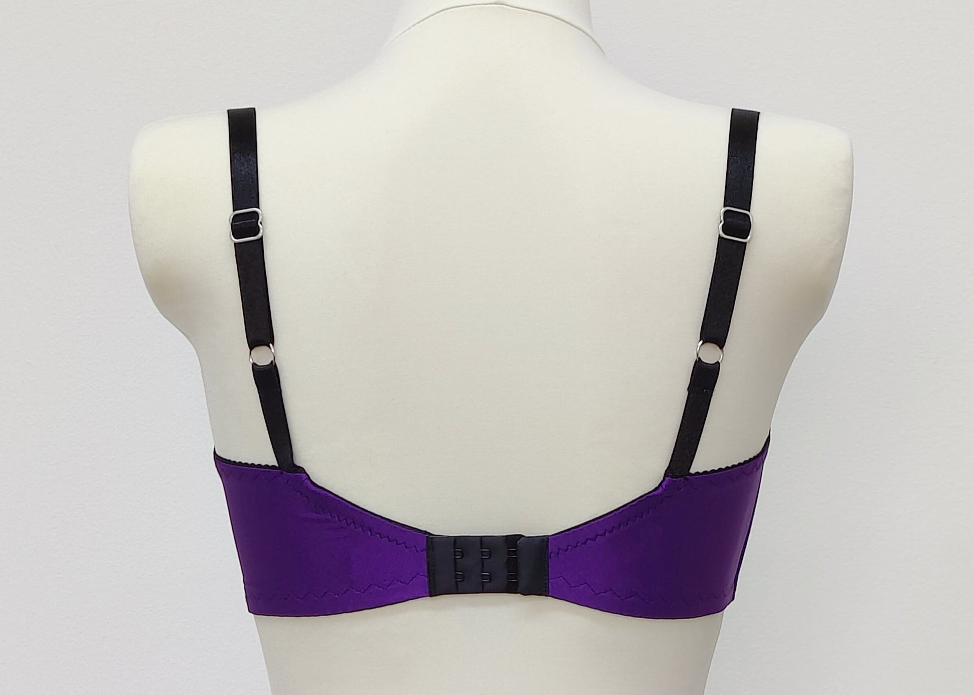 Purple LUCY Quarter cup bra with black lace and straps, size US 34C or EU 70C, back view