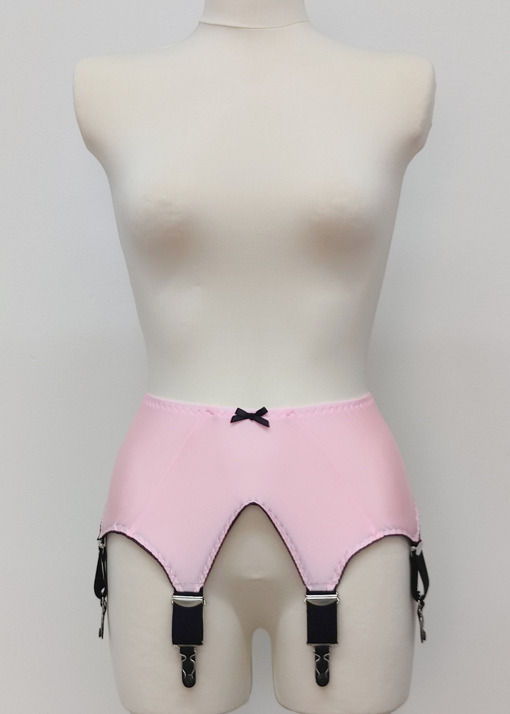 pink wide vintage style Iris garter belt, with black trim and 6 extra wide black straps 
