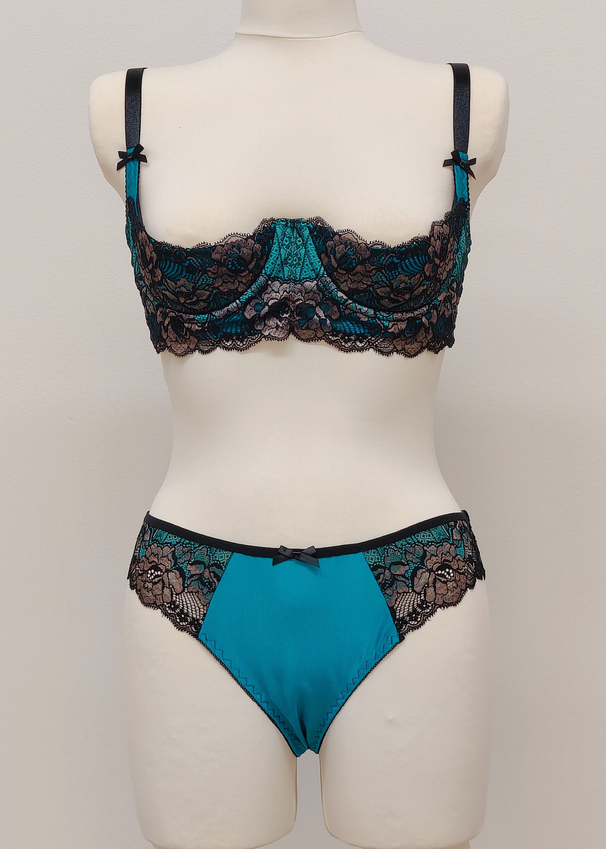teal and black lace quarter cup bra with panties