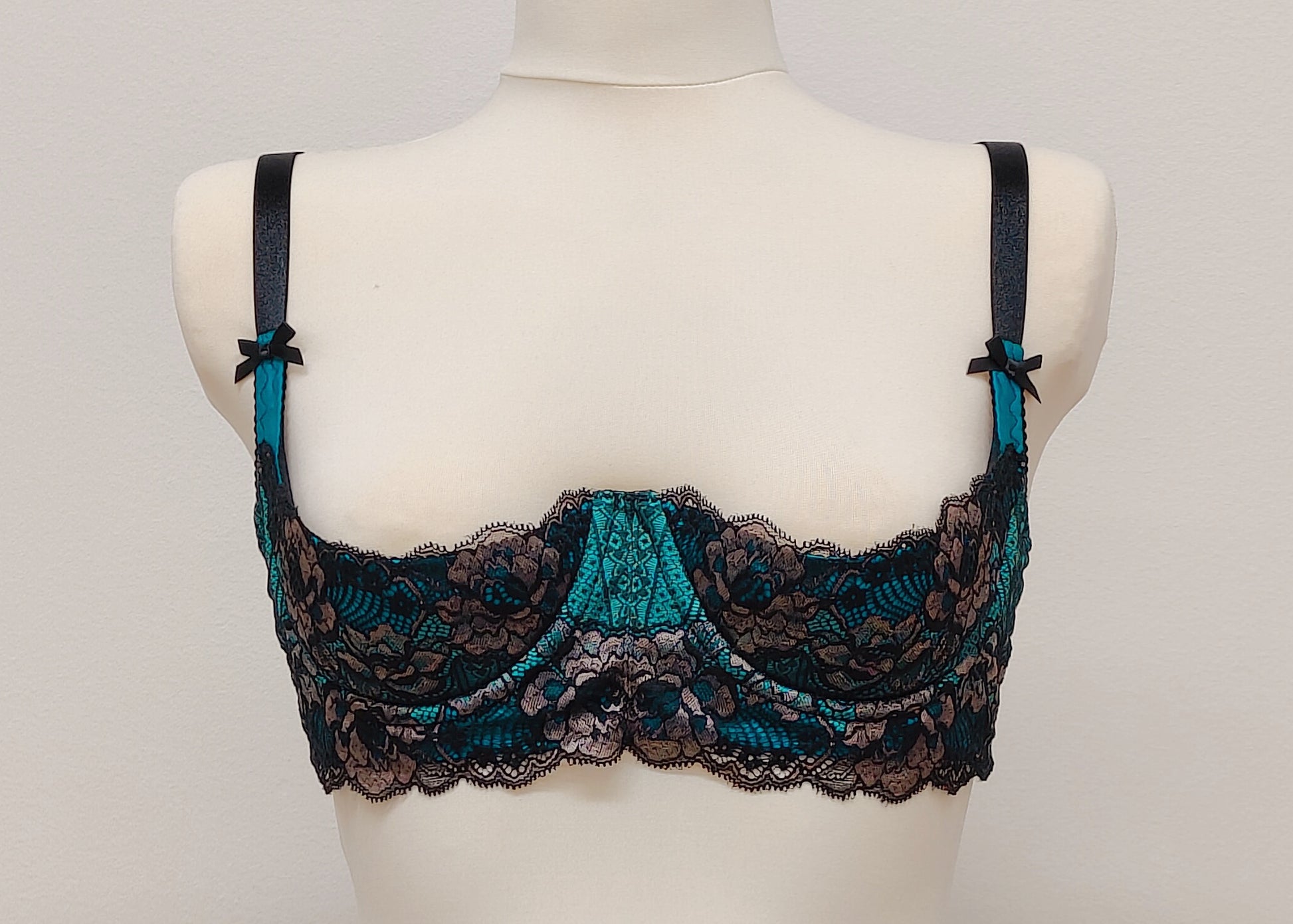 teal and black lace quarter cup bra