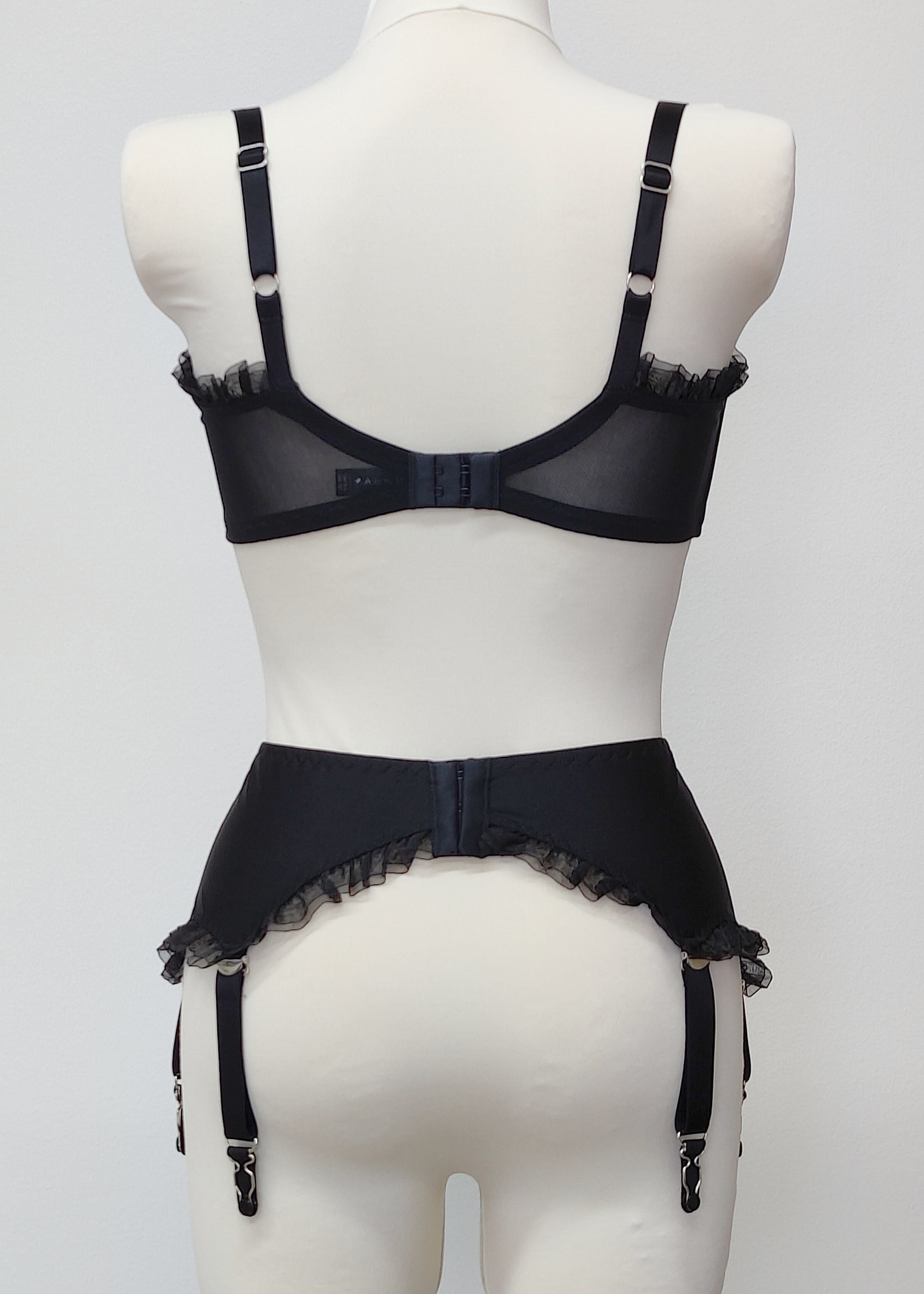 black 6 strap garter belt with ruffle trim, back