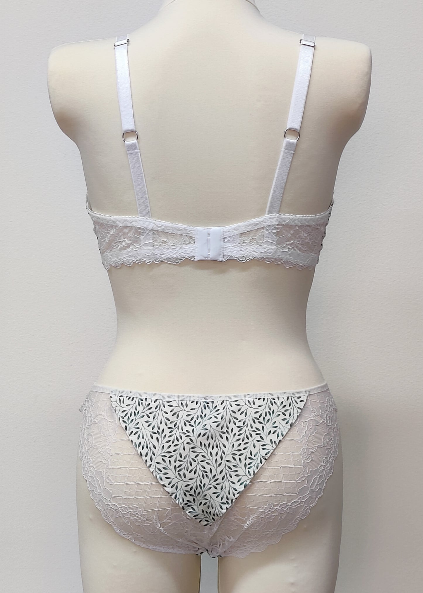 white panties with tiny green leaves, white elastic lace panels on the back