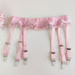 pink narrow 60's style, 6 strap garter belt with ruffle trim