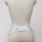 White 10 strap Gigi garter belt with ruffle trim, back view