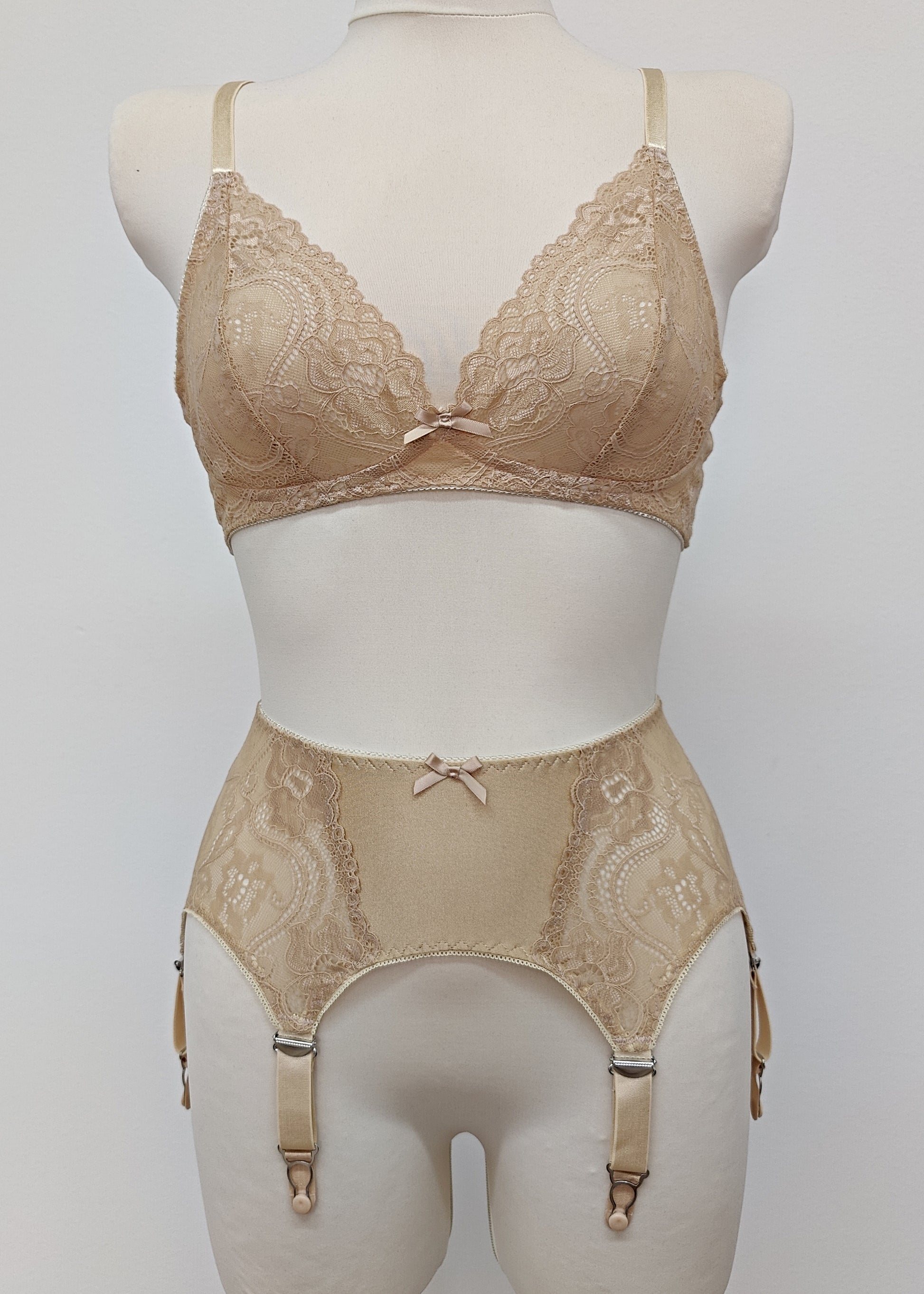 Beige 6 strap retro style garter belt with side lace panels, shown with matching lace bralette