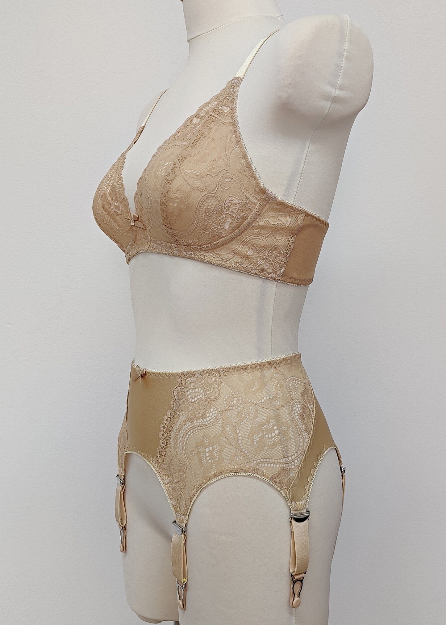 Beige 6 strap retro style garter belt with side lace panels, shown with matching lace bralette, side view