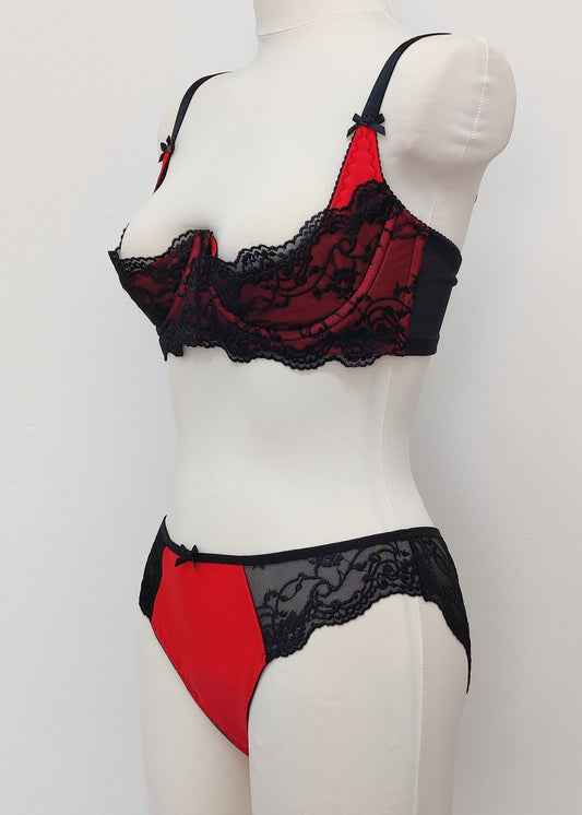 red quarter cup bra with black lace, with matching panties