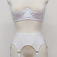 White narrow Nina garter belt, 60's style with 6 adjustable straps and hook and eye closure at the back. Shown with Lucy quarter cup bra.