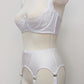 White narrow Nina garter belt, 60's style with 6 adjustable straps and hook and eye closure at the back. Shown with Lucy quarter cup bra. Side view