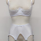 White wide Iris garter belt with a deep V-style design, featuring six extra wide adjustable straps, shown with matching white lace Lucy quarter cup bra