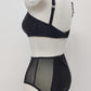 black high waist Mia panties with sheer side panels, with matching bralette, back view