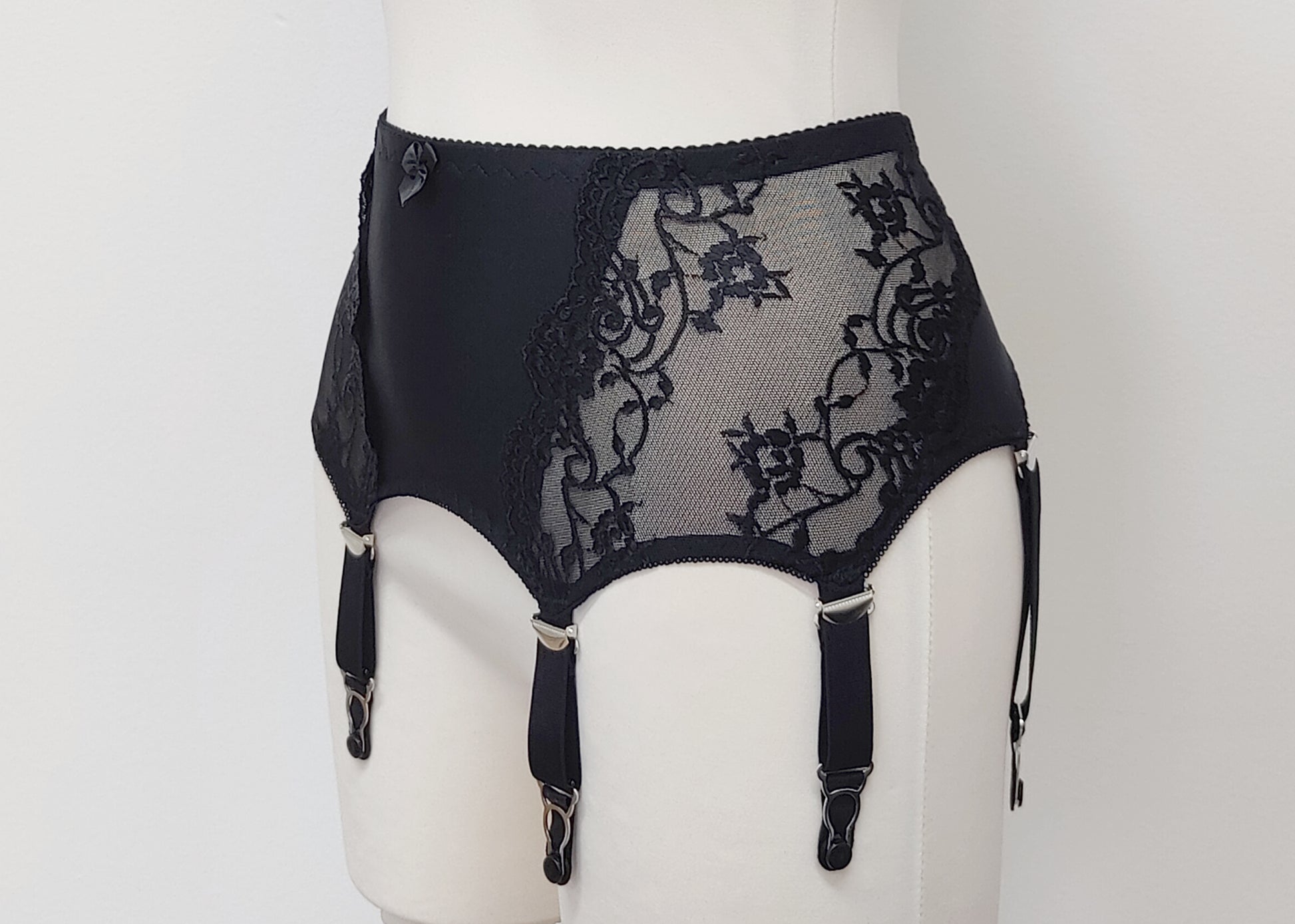 wide retro style Liliane garter belt with  6 wide straps and black lace side panels, side view