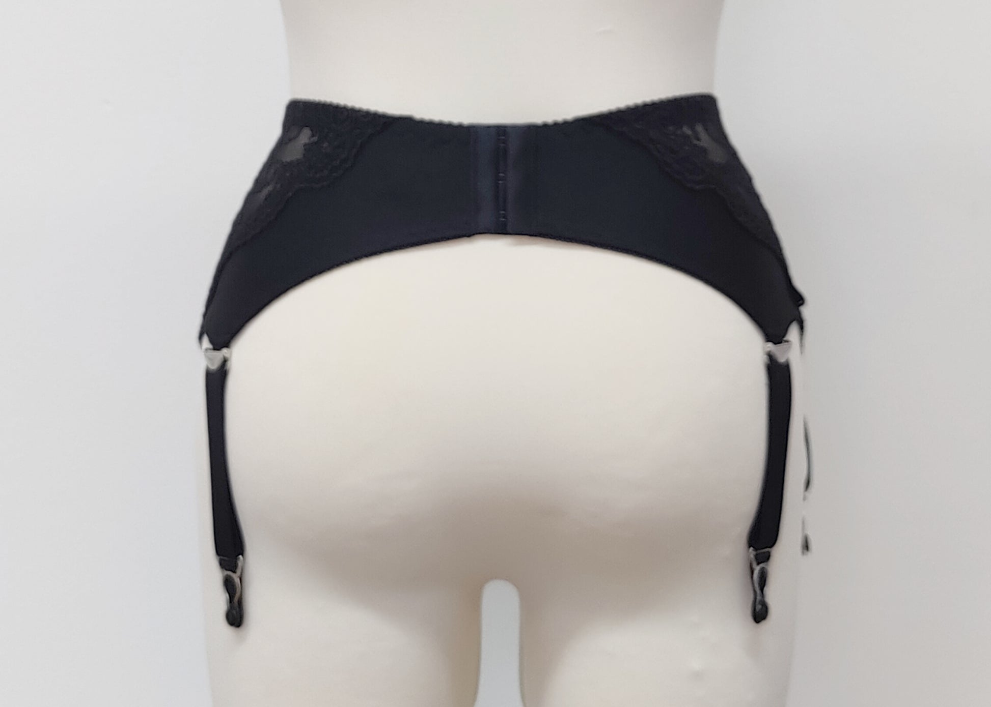 wide retro style Liliane garter belt with  6 wide straps and black lace side panels, back view