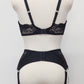 wide retro style Liliane garter belt with  6 wide straps and black lace side panels, with matching bra, back view