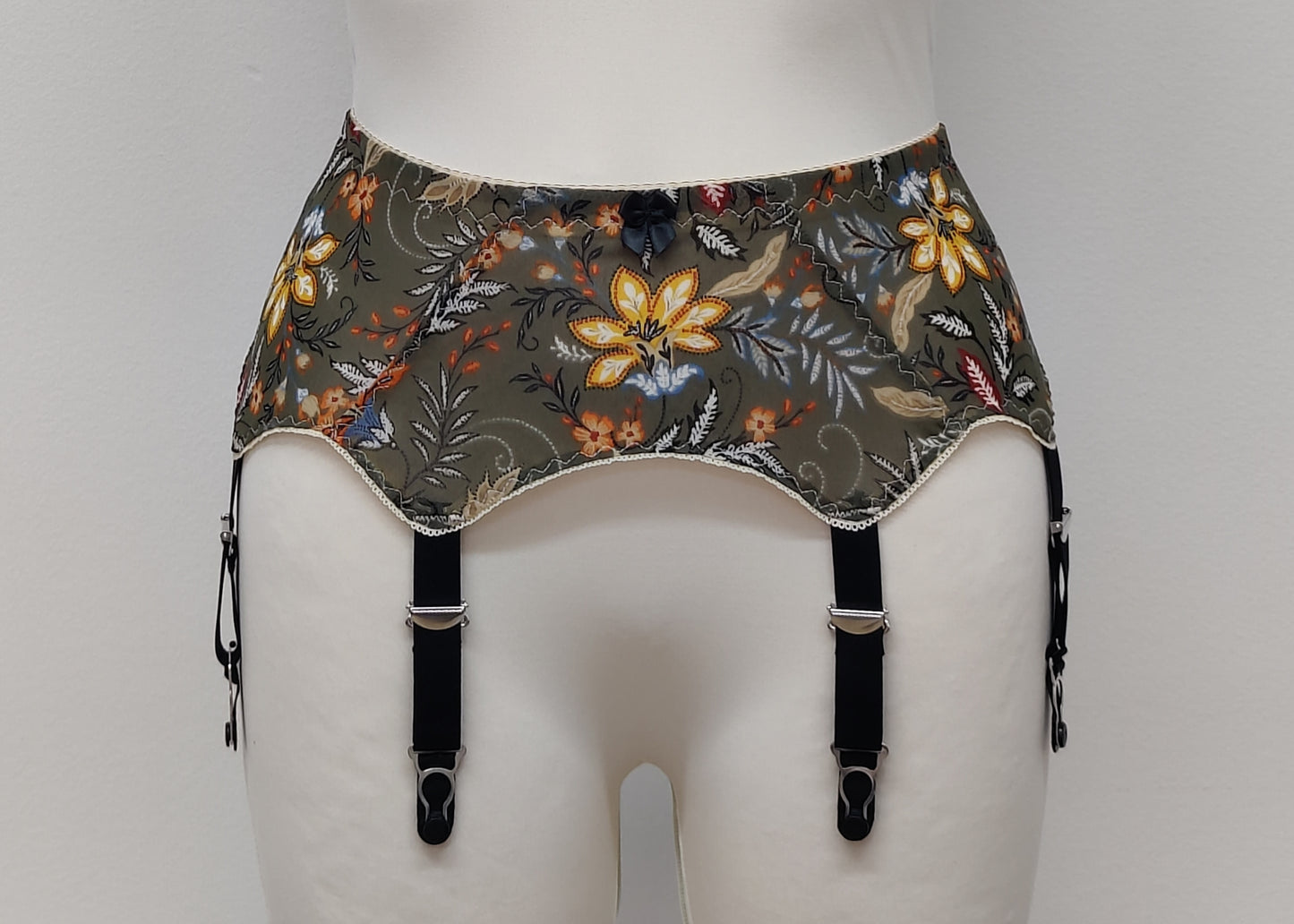 retro style Leilani suspender belt, made with olive green floral mesh fabric, with 6 wide straps