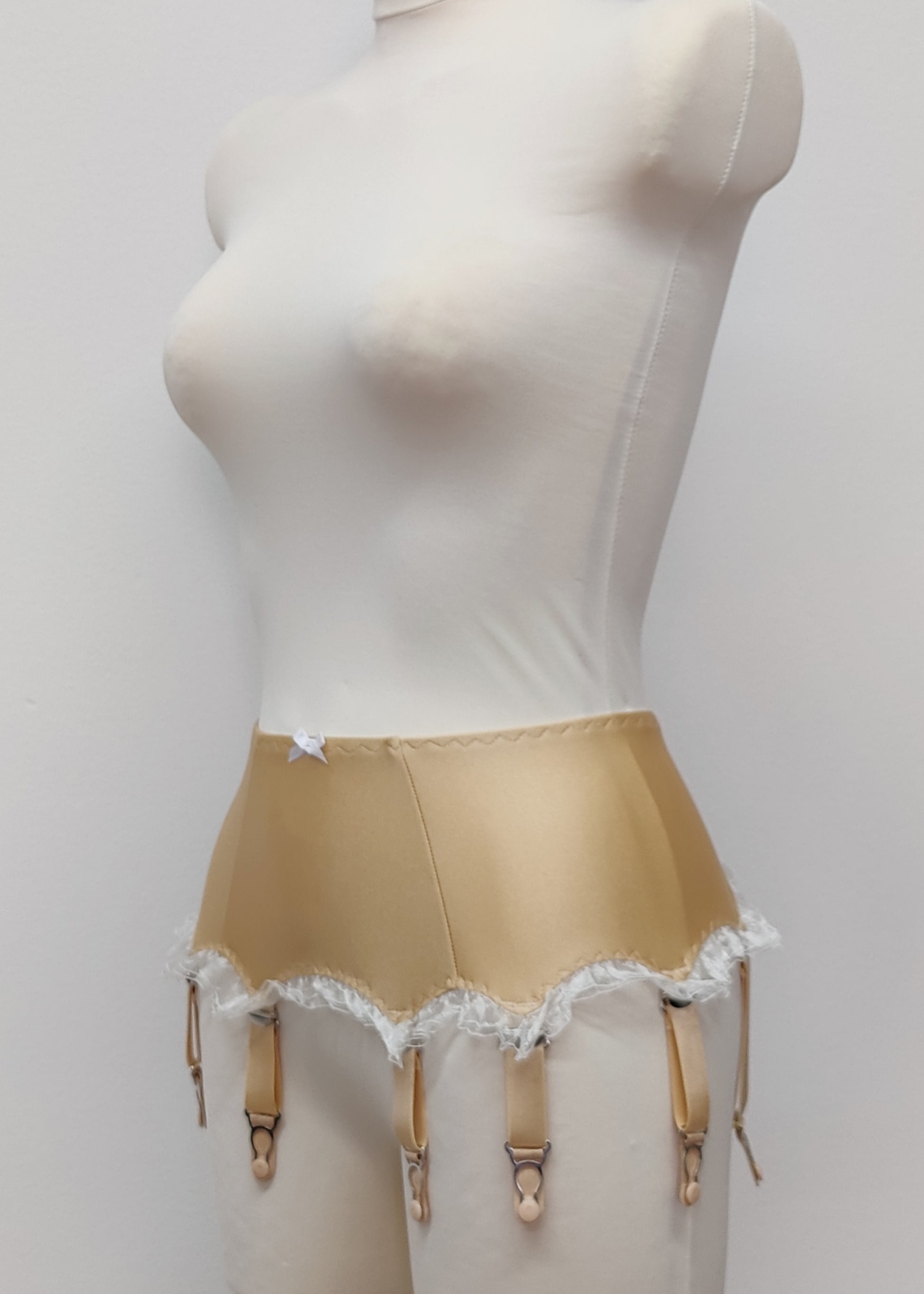 beige 8 strap Gigi garter belt with white ruffle trim