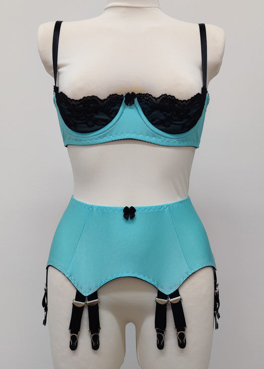 baby blue 12 strap Joan garter belt with black straps, shown with matching Lucy quarter cup bra