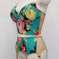 turquoise and pink floral long-line Rosie bra, shown with matching garter belt, side view