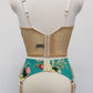 turquoise and pink floral long-line Rosie bra, shown with matching garter belt, back view