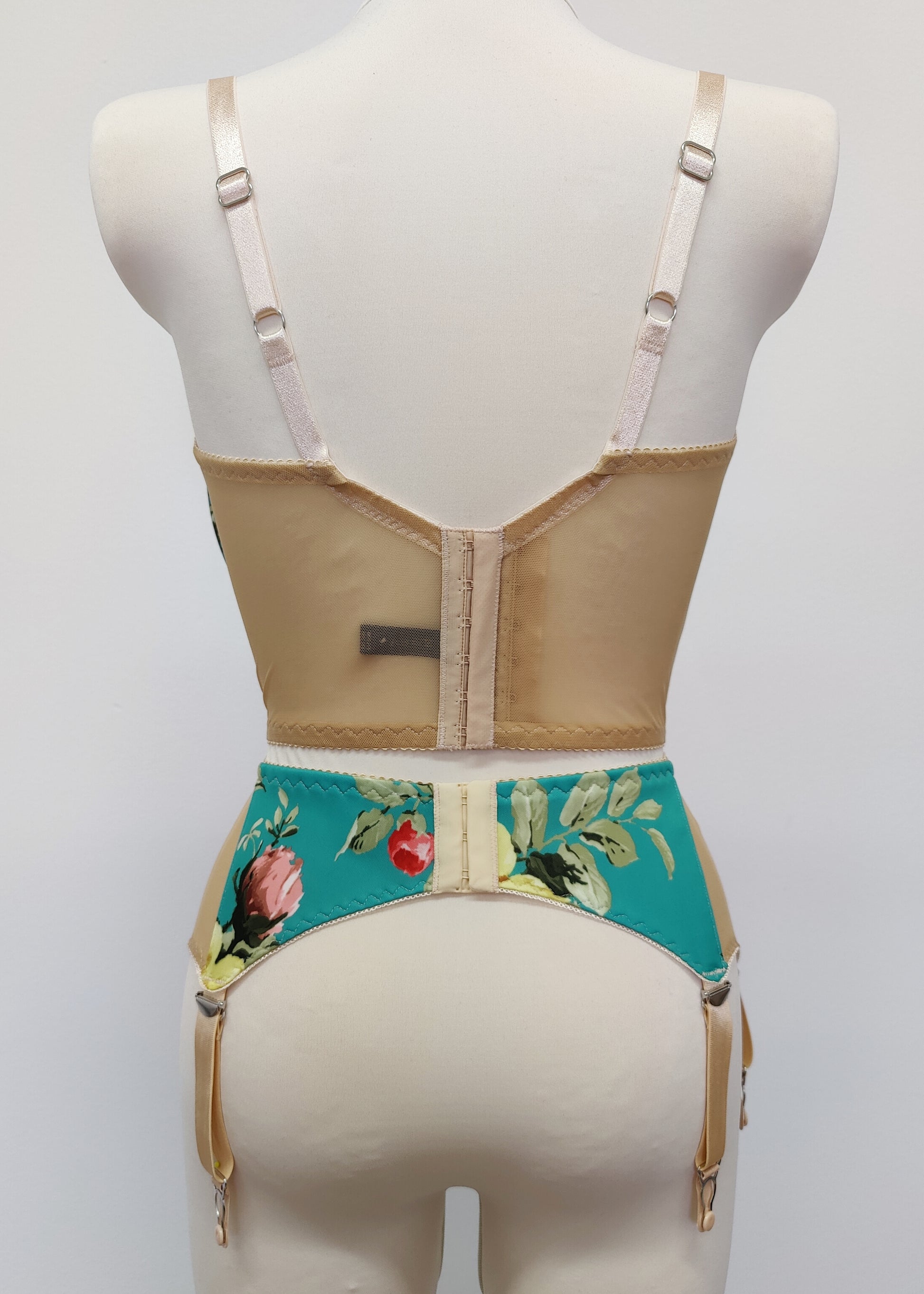 turquoise and pink floral long-line Rosie bra, shown with matching garter belt, back view