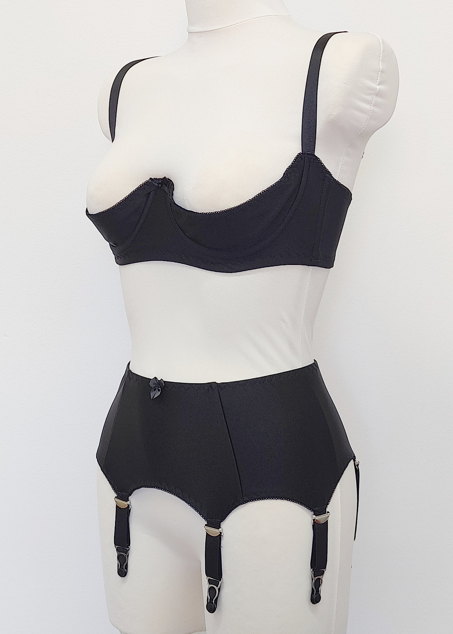 black, classic, retro style Greta garter belt with 6 straps, here shown with matching quarter cup bra, side view