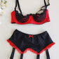 black 4 strap Gigi garter belt with red ruffle trim and bow, shown with red/black Lucy bra
