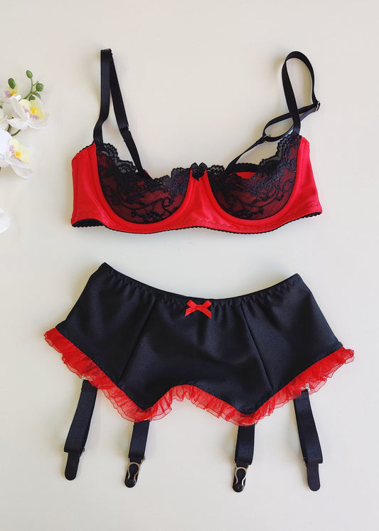 black 4 strap Gigi garter belt with red ruffle trim and bow, shown with red/black Lucy bra