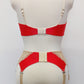 Red quarter cup Lucy bra with beige lace, straps and trims, here shown with matching retro style Mona garter belt , back view