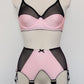 pink Audrey bra with black sheer upper part of the cup, with matching Iris garter belt