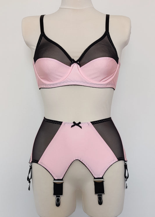 pink Audrey bra with black sheer upper part of the cup, with matching Iris garter belt