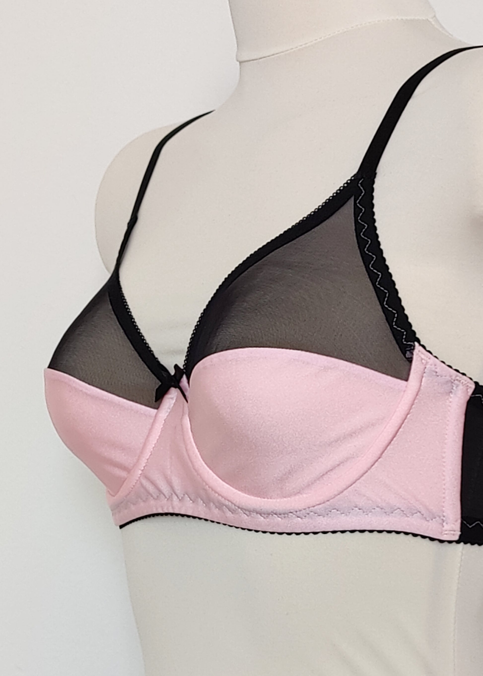 pink Audrey bra with black sheer upper part of the cup