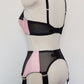 pink Audrey bra with black sheer upper part of the cup, with matching Iris garter belt, back view